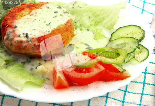 Image of Fishcakes with vegetables. 