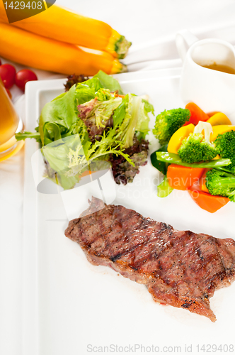 Image of juicy BBQ grilled rib eye ,ribeye steak and vegetables