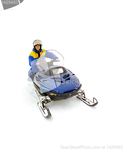Image of Man driving snowmobile