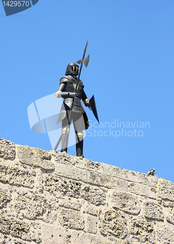 Image of Knight in armour sky blue on a wall in the Old Rhodes Town in Gr