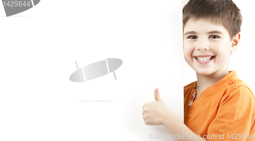 Image of Smiling boy showing thumb