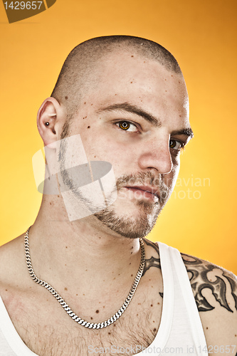 Image of man with tattoos