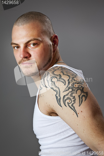 Image of man with tattoos