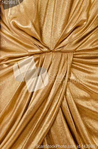 Image of folds gold fabric closeup