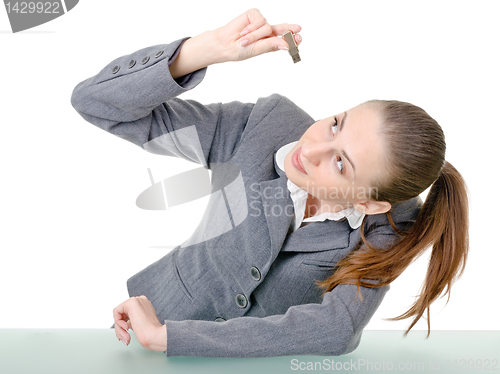 Image of office manager, a woman examining flash drive