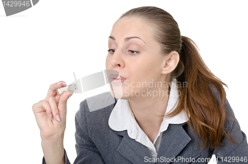 Image of office manager, a woman examining flash drive
