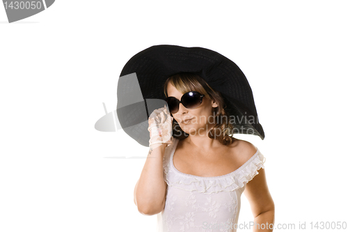 Image of woman in black hat  and sunglasses