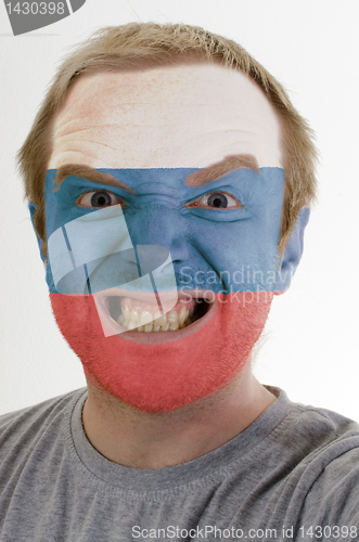 Image of Face of crazy angry man painted in colors of russia flag