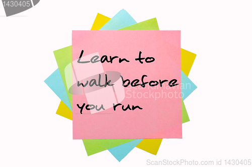 Image of Proverb "Learn to walk before you run" written on bunch of stick