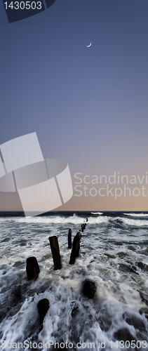 Image of Moonrise over surf