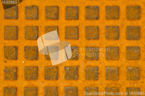 Image of Great rusty iron metal sewer lid background.