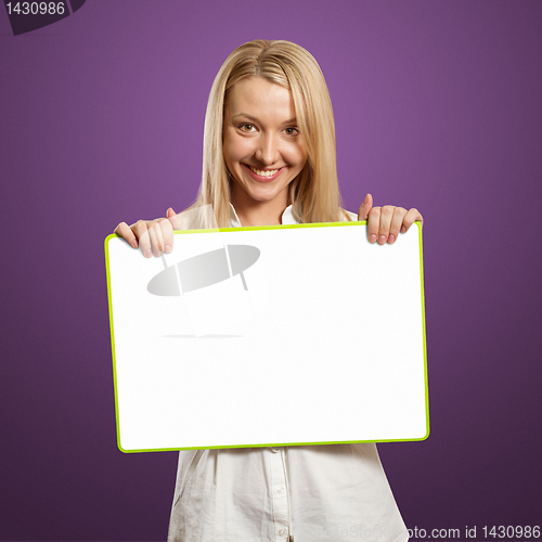 Image of happy businesswoman holding blank white card