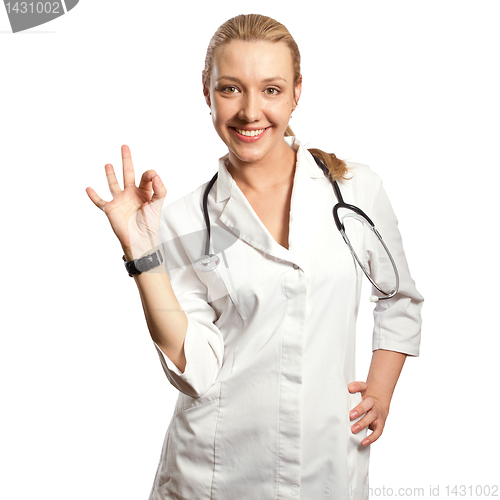 Image of young doctor woman shows ok
