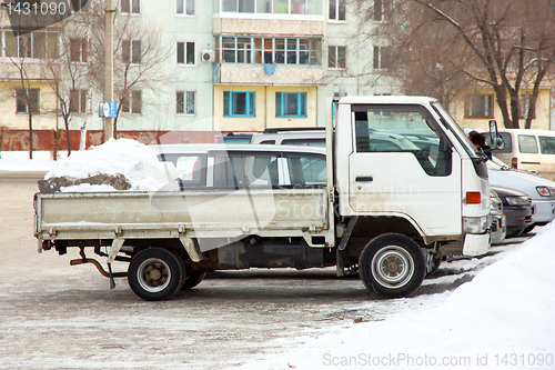 Image of The truck of white color with snow 