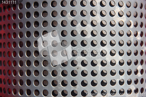 Image of metal holed or perforated grid background