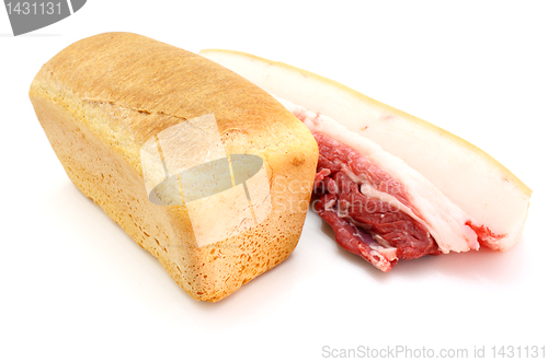 Image of Roll of fresh bread and the big piece of fat with meat 