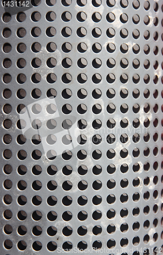 Image of metal holed or perforated grid background