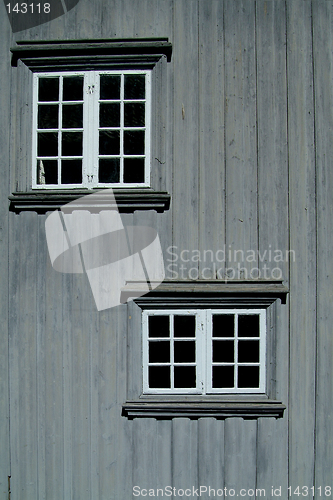 Image of Two windows on a gray wall