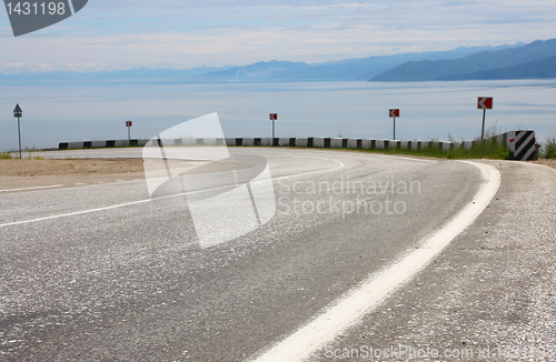 Image of Asphalt road and sky with clouds