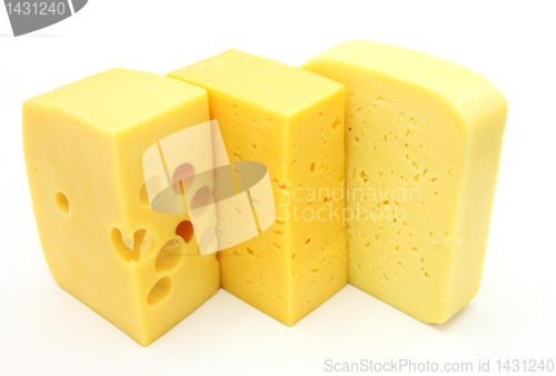 Image of three pieces of different kinds of cheese
