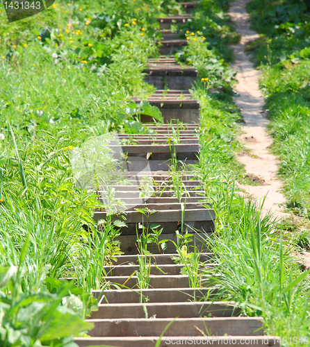 Image of The wooden ladder is located a hill slope