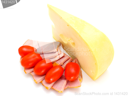 Image of Cheese with holes and red tomatoes 