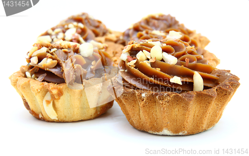 Image of Pie a basket with chocolate condensed milk and nuts 