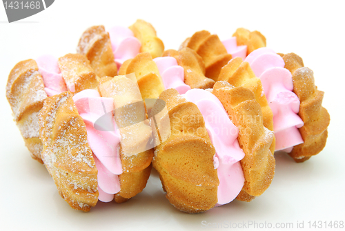 Image of Yellow cookies with a  stuffing  on a white background 