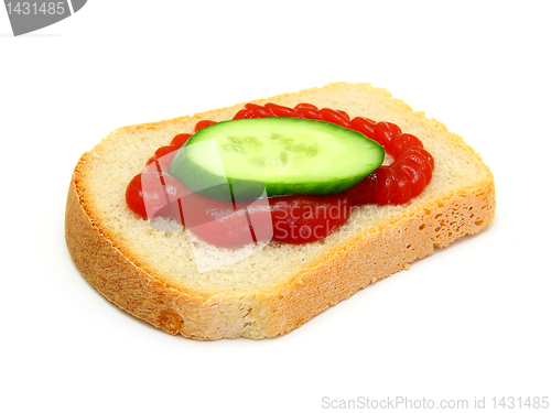 Image of  sandwich with Ketchup and a cucumber