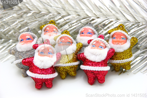 Image of Some dolls of Santa Claus are together 