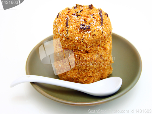 Image of Honey cake with chocolate on a white background