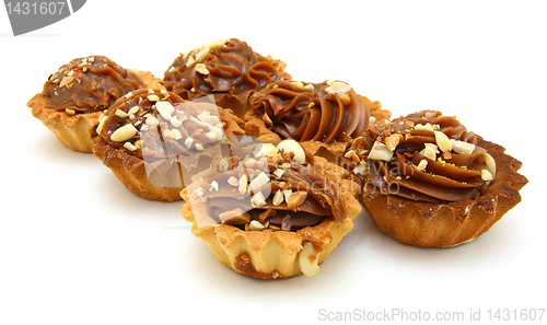 Image of Pie a basket with chocolate condensed milk and nuts 