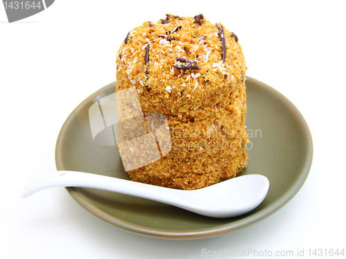 Image of Honey cake with chocolate on a white background