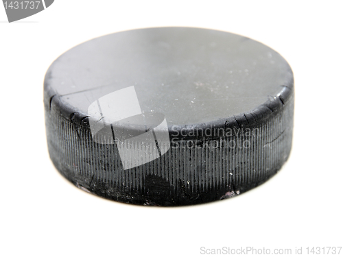 Image of Black old hockey puck