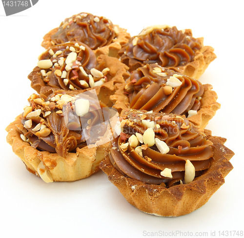 Image of Pie a basket with chocolate condensed milk and nuts 