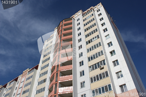 Image of The inhabited high house against the blue sky