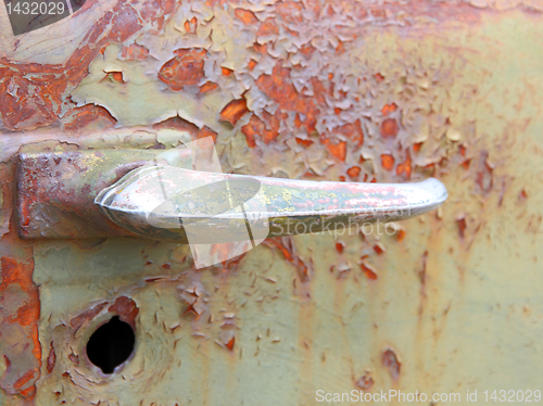 Image of rusty old car handle
