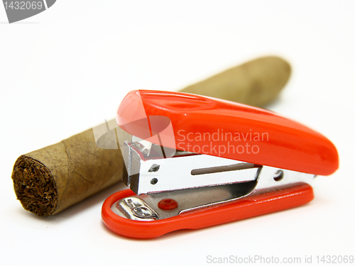 Image of Red stapler and cigar 