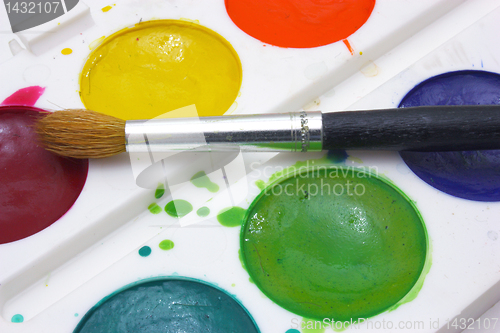 Image of Paints with brushes