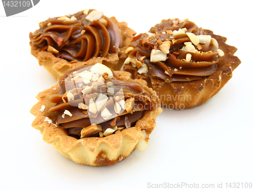 Image of Pie a basket with chocolate condensed milk and nuts 