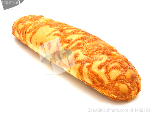 Image of The ruddy long loaf of bread is strewed by cheese 