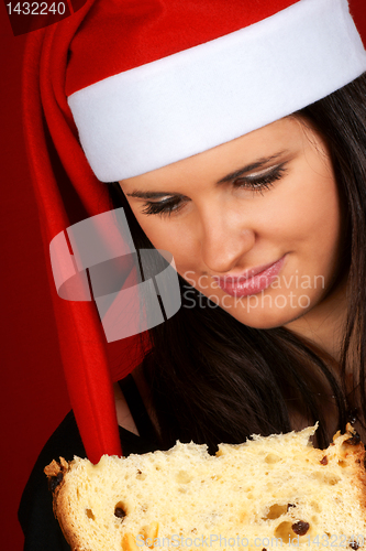 Image of Santa Claus girl eating panettone