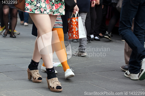 Image of Women legs in crowd