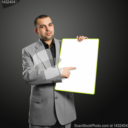 Image of happy businesswoman holding blank white card