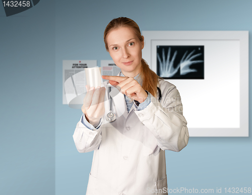 Image of doctor woman with cup for analysis