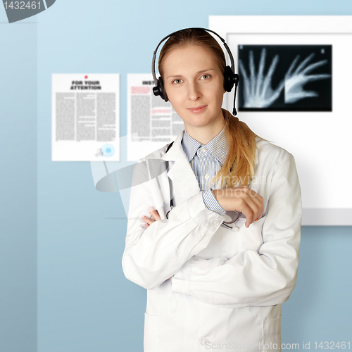 Image of doctor woman with headphones smile at camera