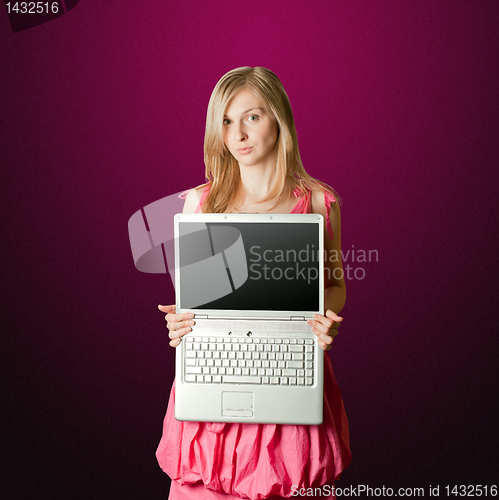 Image of femaile in pink with open laptop