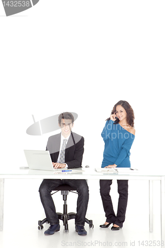 Image of boy and girl smiling while talking to phone