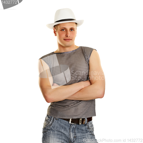 Image of A young man in a T-shirt, jeans and a hat