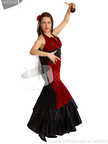 Image of A young girl performs Spanish dance with castanets